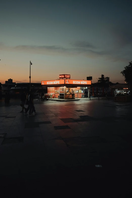 some people standing near a store by the street