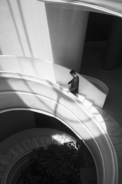 a man that is walking down some stairs