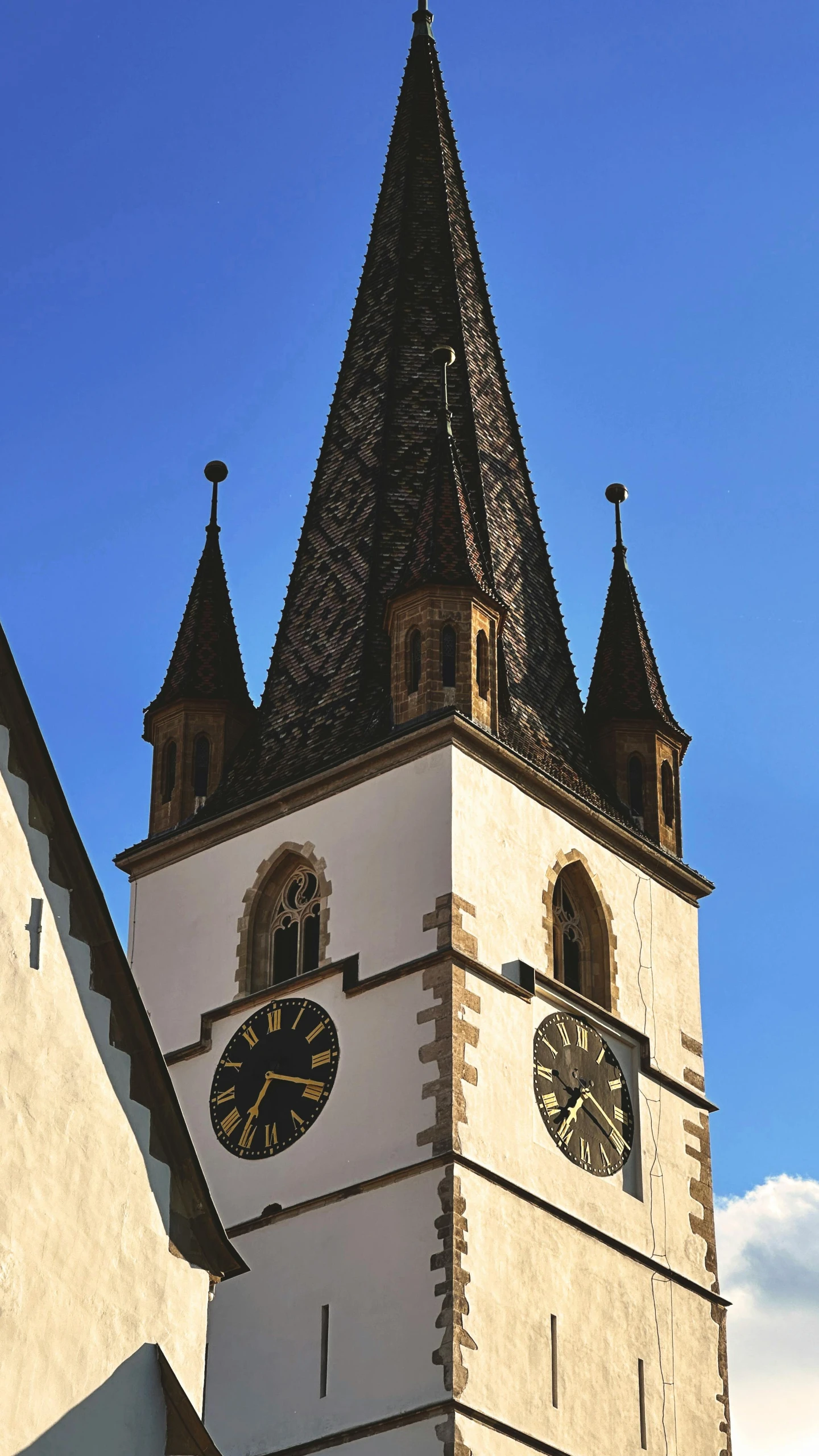 the tower with three clocks has a clock displayed below it