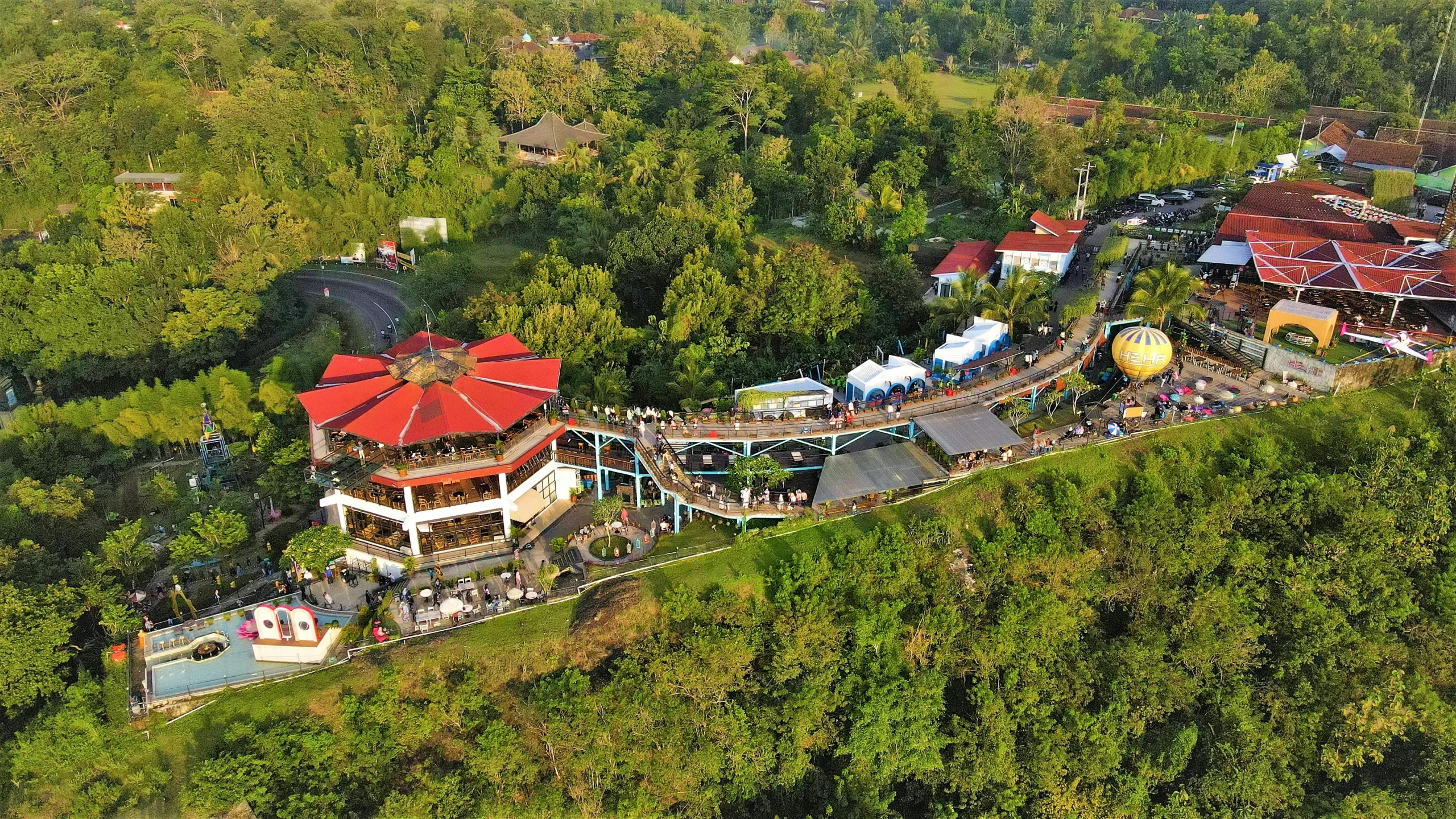 an amut park with trees and a hill