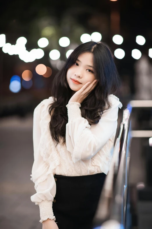 asian woman standing near a car on the street