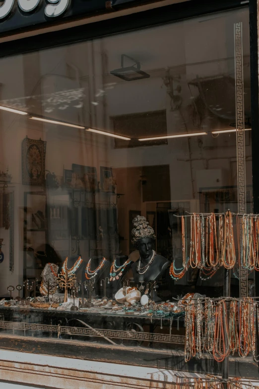 a display case is full of jewelry and other decorative items