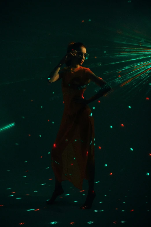 a woman dancing with colorful lights and music in her hands
