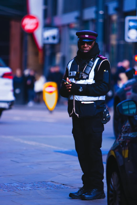 a cop in the street wearing a black and white jacket