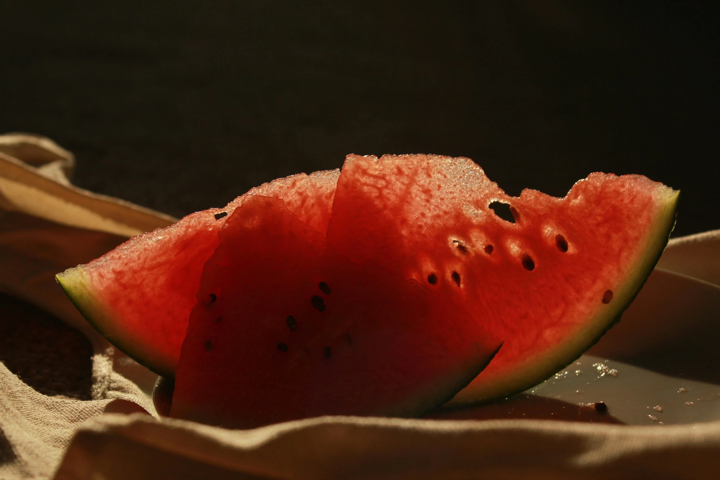 a piece of watermelon that is being sliced