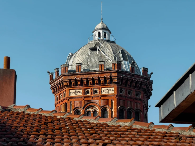 a building with a domed top sits next to some bricks