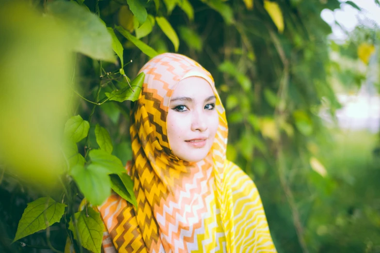 an oriental lady poses with her heads down for a po