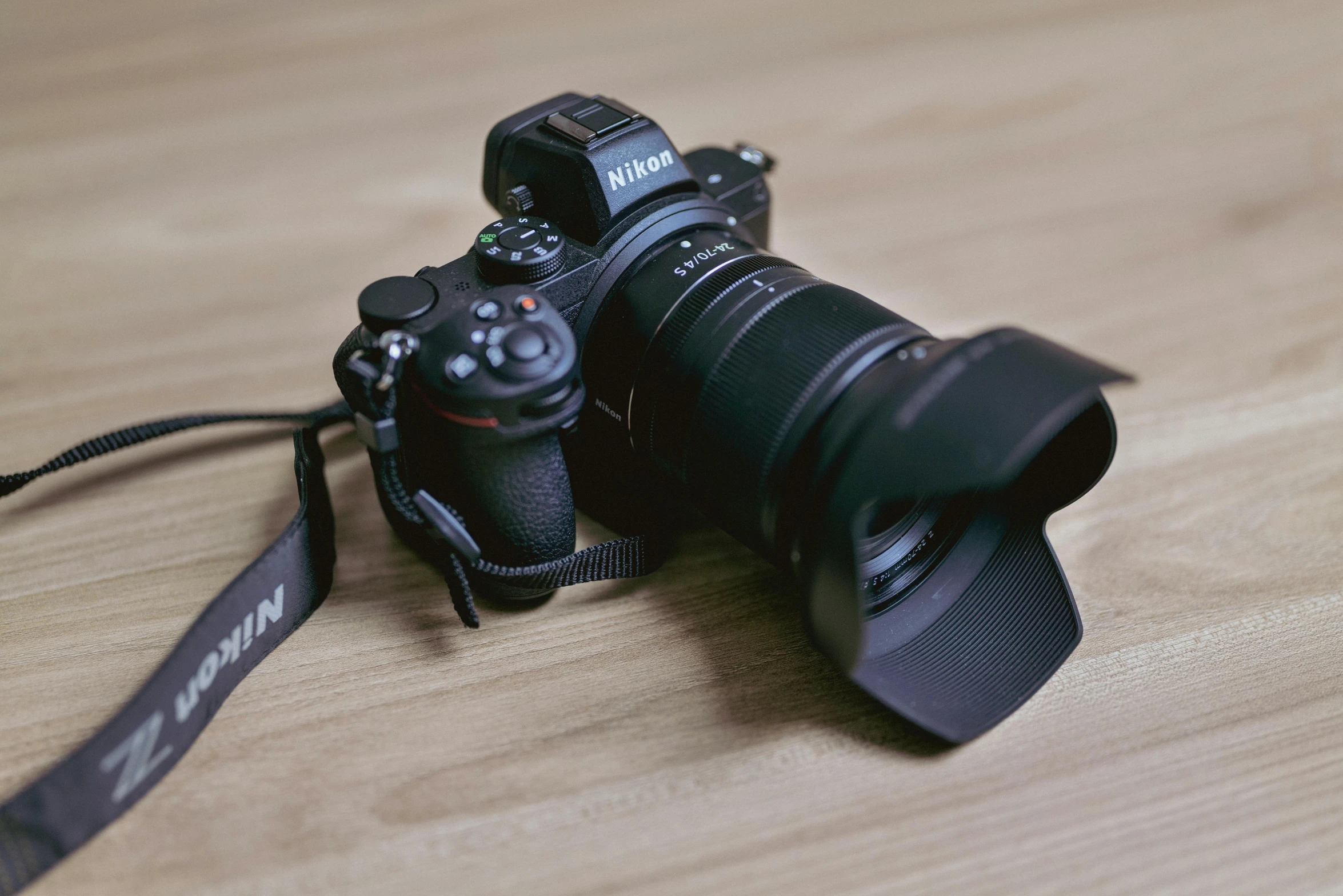 two camera bodies that are sitting on a table