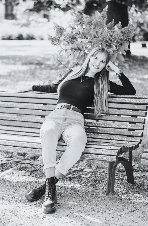 a  posing on a park bench