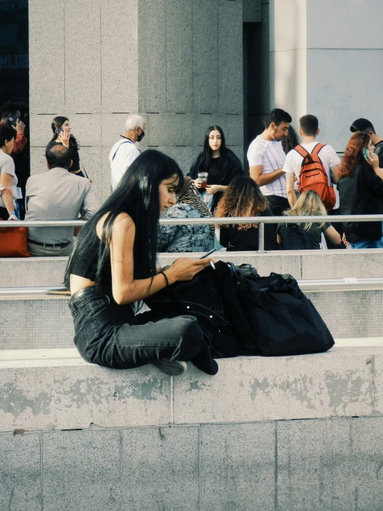 a person sitting in the middle of a street