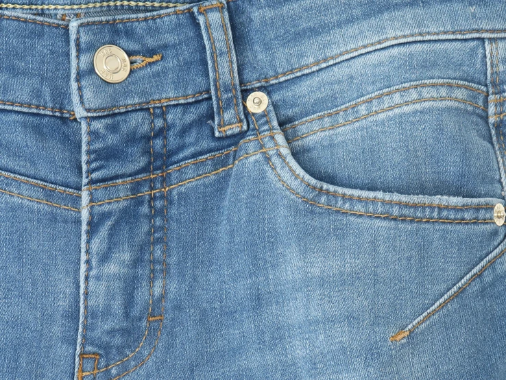 the back view of blue jeans with metal zippers