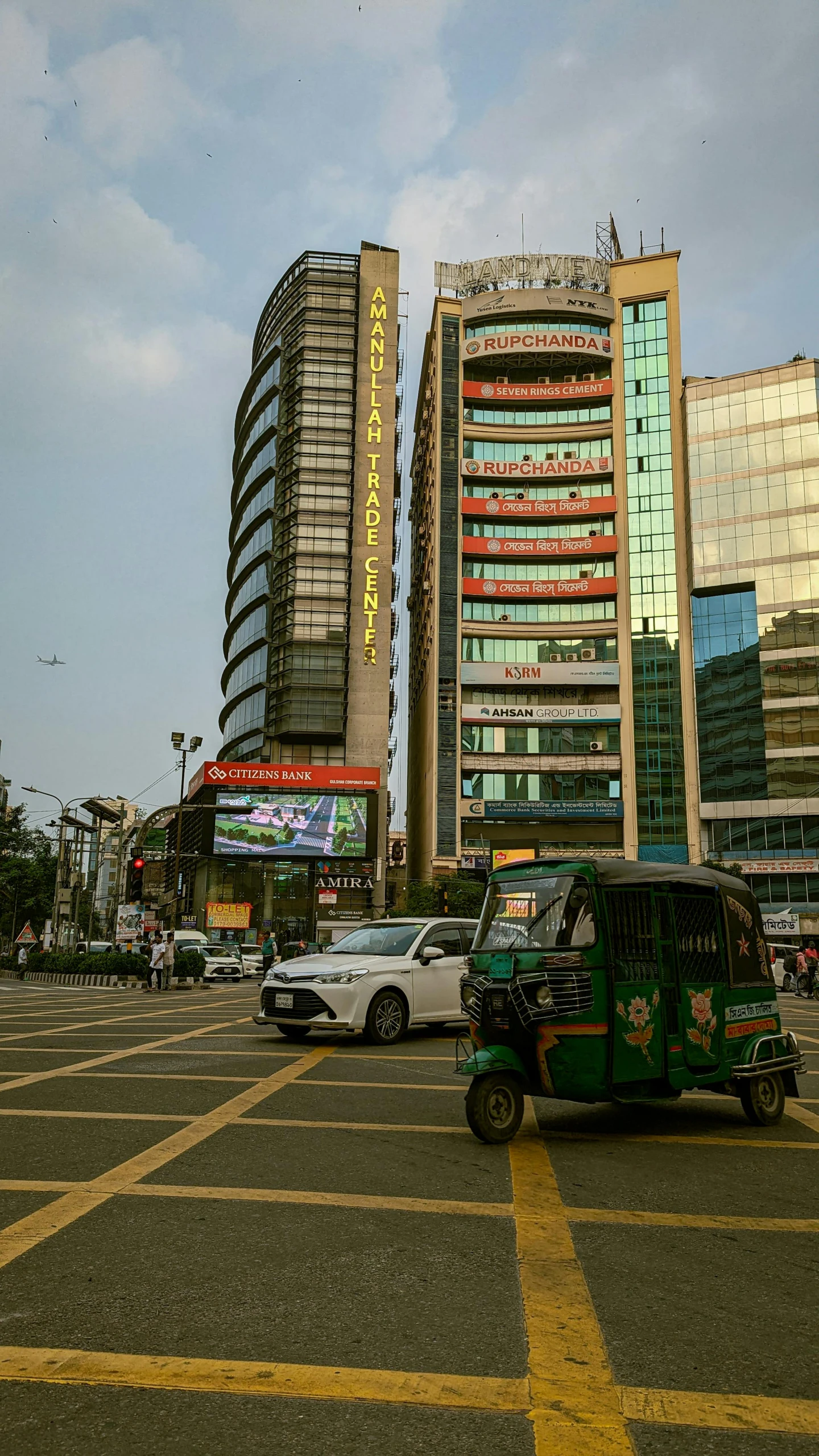 a very tall building with cars on the street