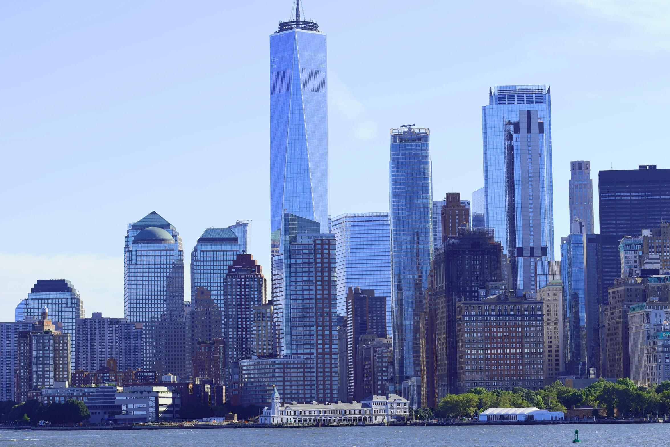 an image of the lower skyline of manhattan as seen from the water