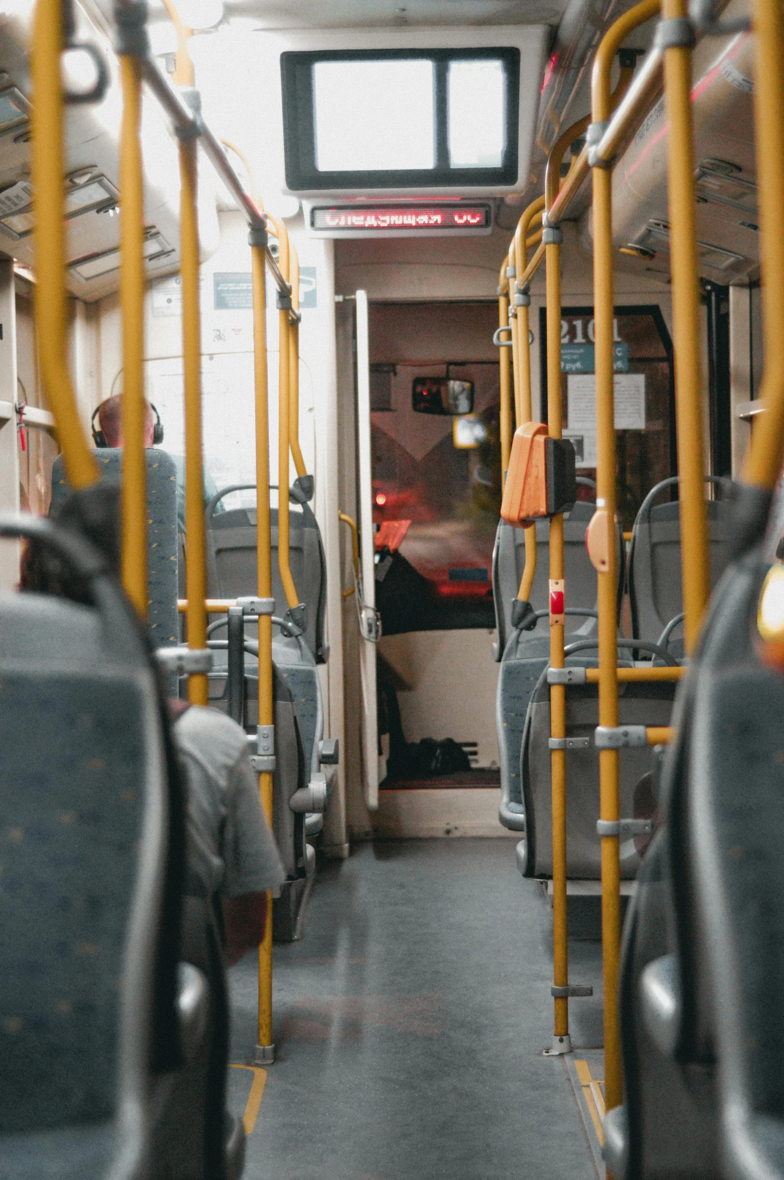 the inside of a subway bus with no people in it