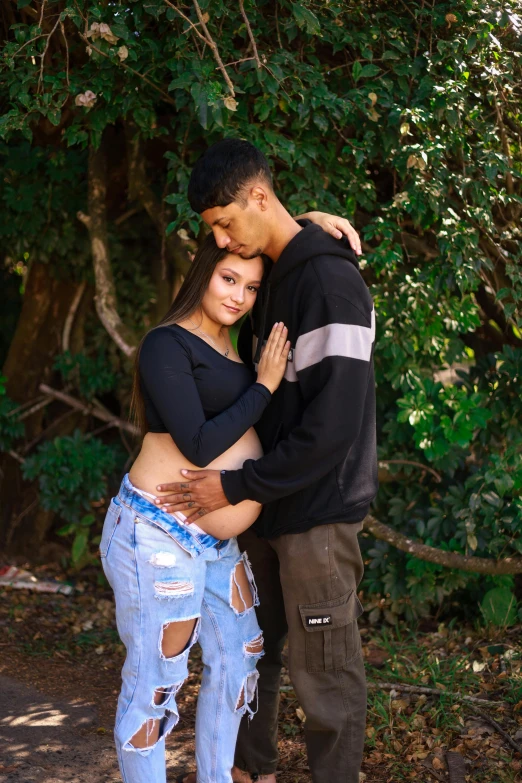 a man and woman standing next to each other on the ground