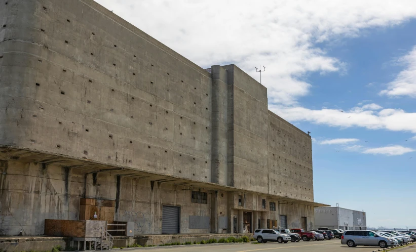 some very big concrete buildings near the ocean