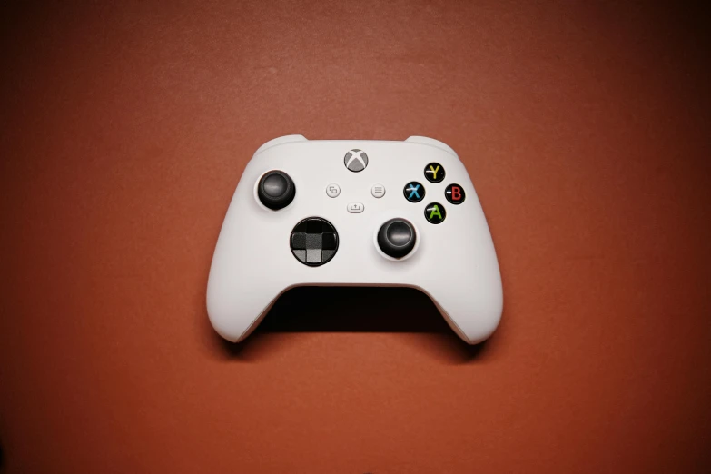 the white controller has many ons on it