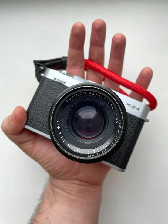 a person holding up a camera in their hands