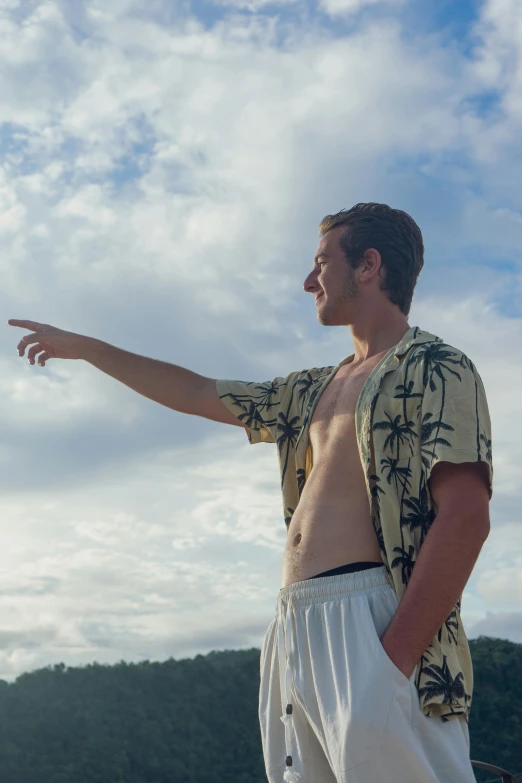 a man holding soing while wearing a shirt