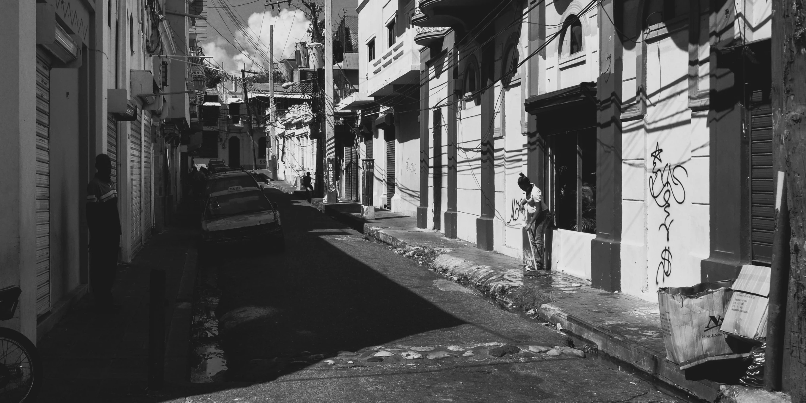 street that leads to a building with lots of windows