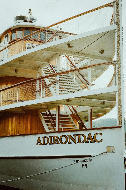 a large white boat sitting next to another ship