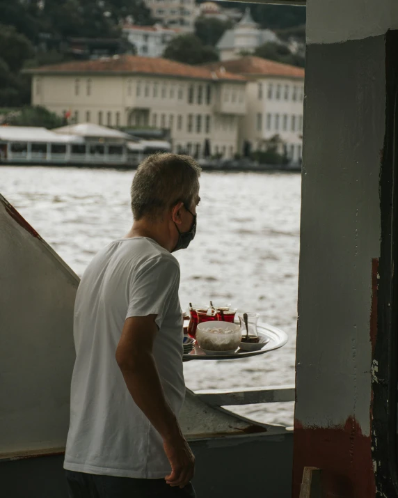 a man that is looking at soing and the water