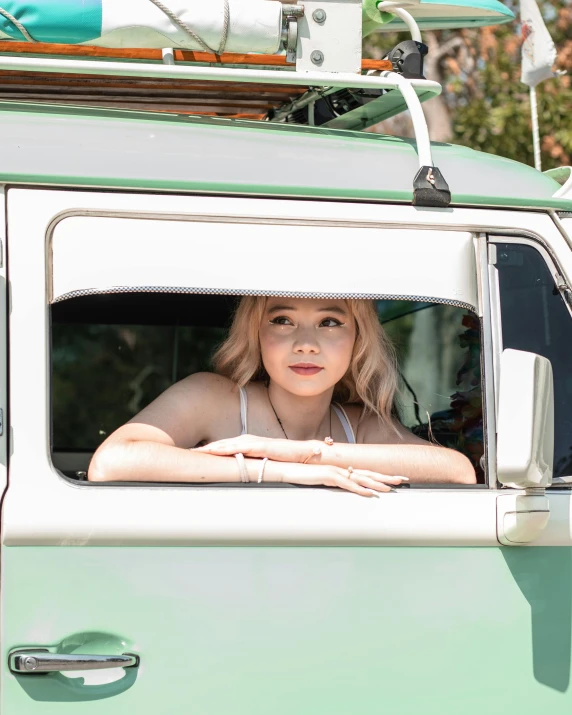 young woman sitting in the passenger seat of a truck