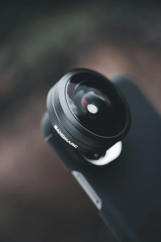 the lens is sitting on top of an iphone