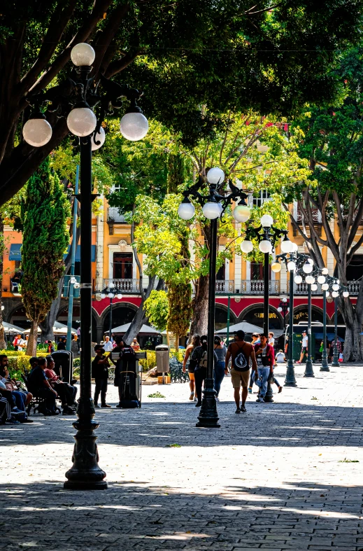 people are walking around in a city park area