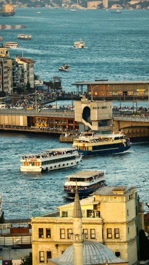 a very big bridge and some big boats