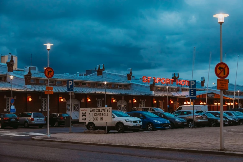 a building with a neon sign at night