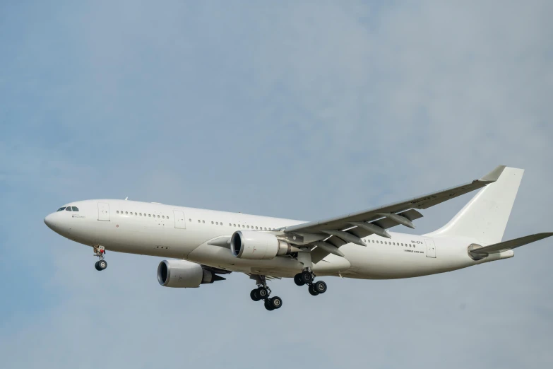 a jumbo jet airliner flying through the air on its maiden feathers