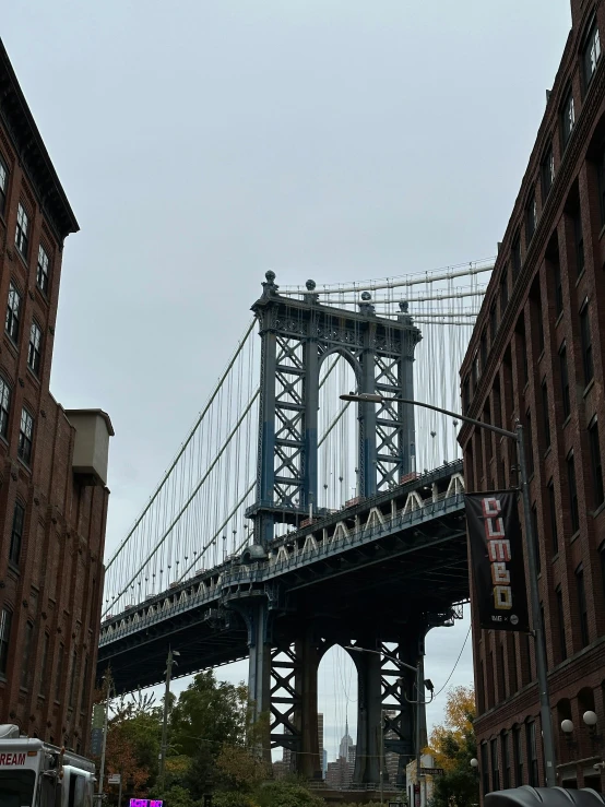 a train traveling over a bridge on top of a very tall building