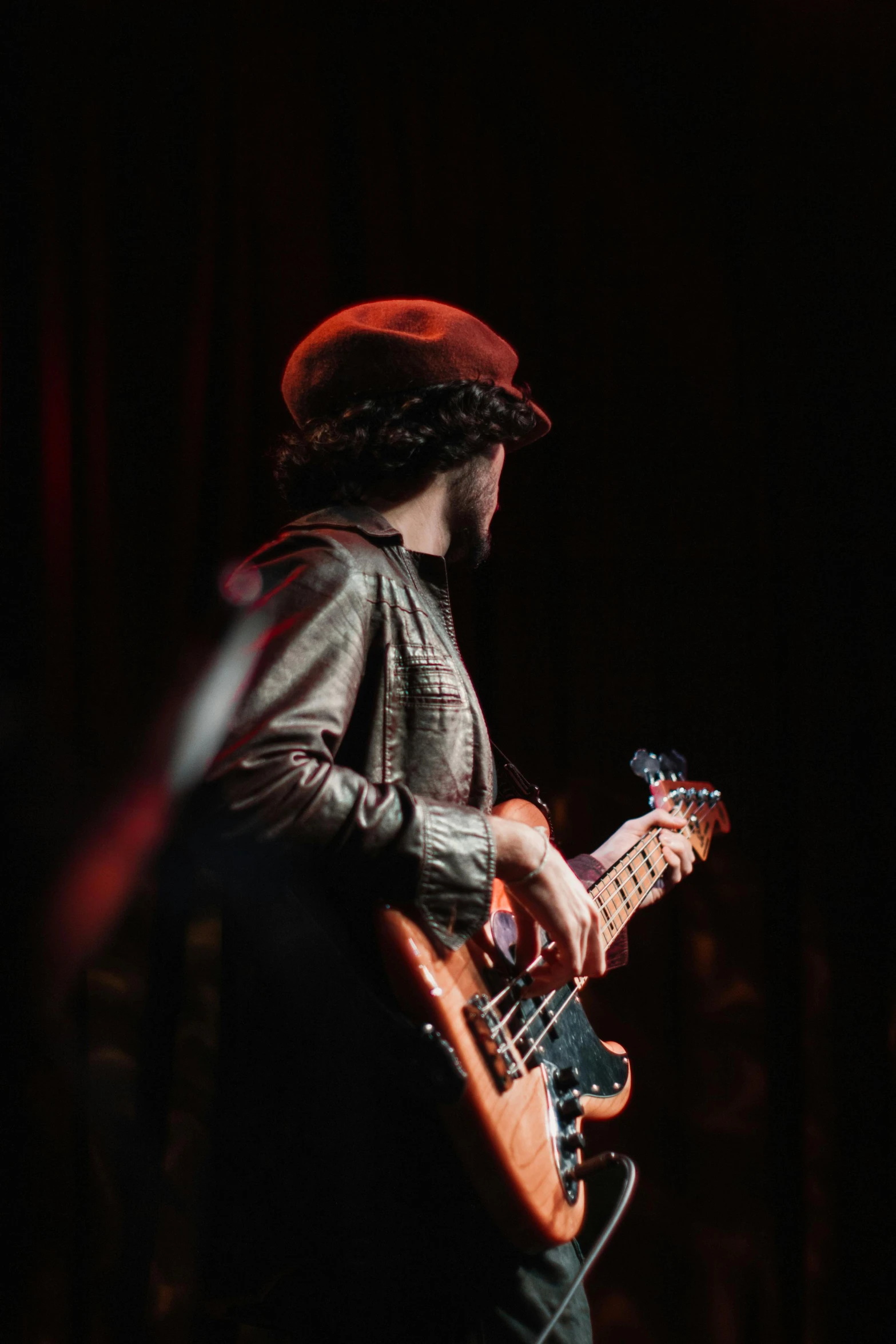 a man standing with a guitar in his hand