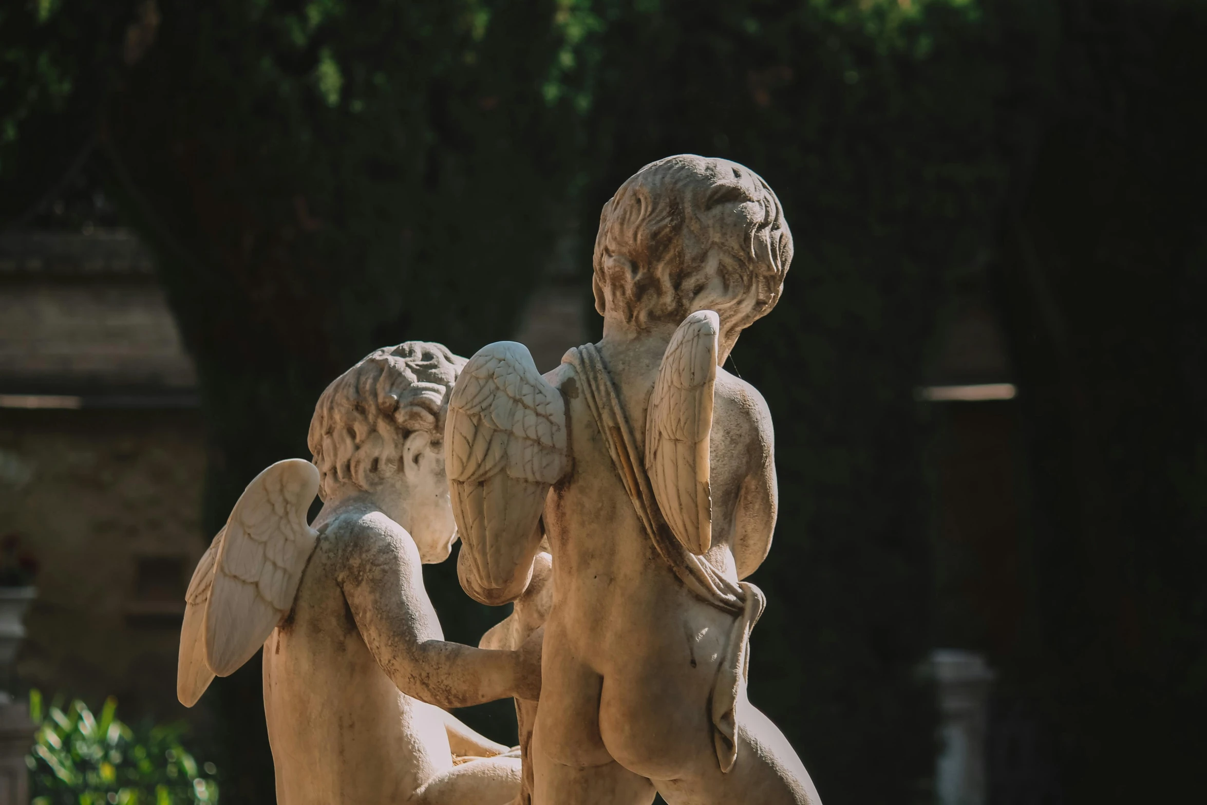 a statue is sitting in the sun