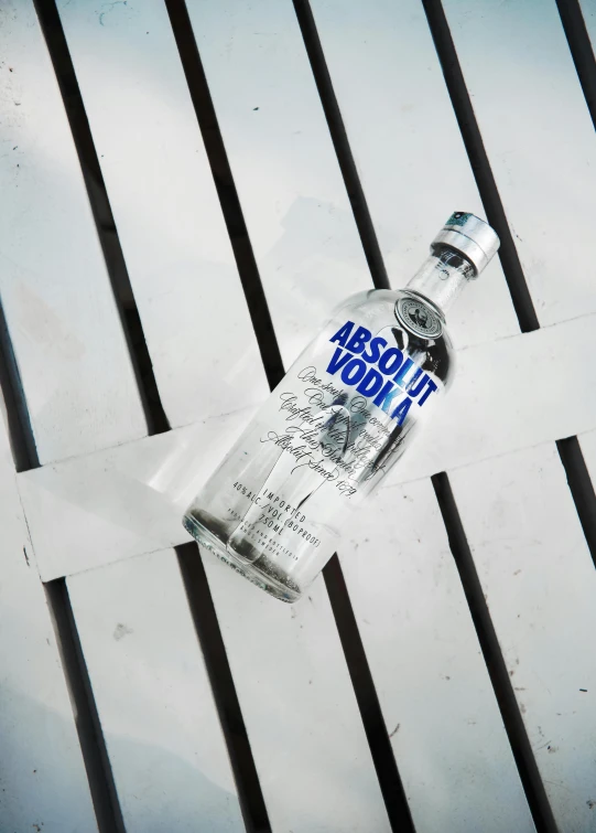 an empty vodka bottle sitting on top of a table