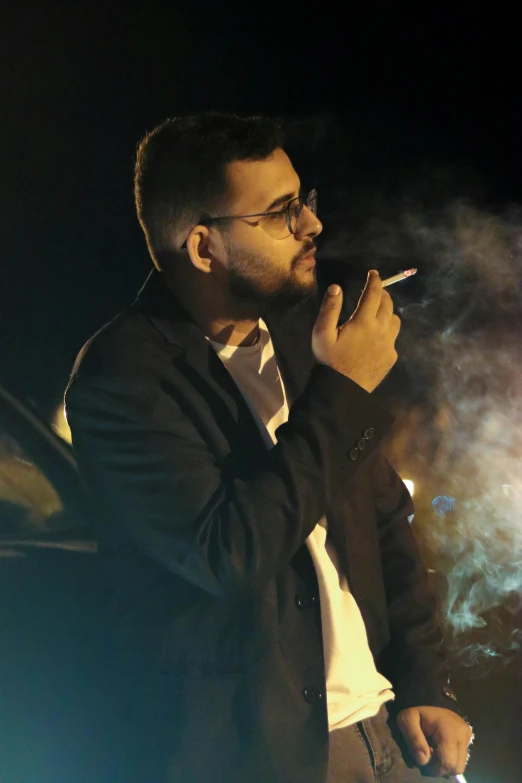 a man is smoking a cigarette with smoke trailing up