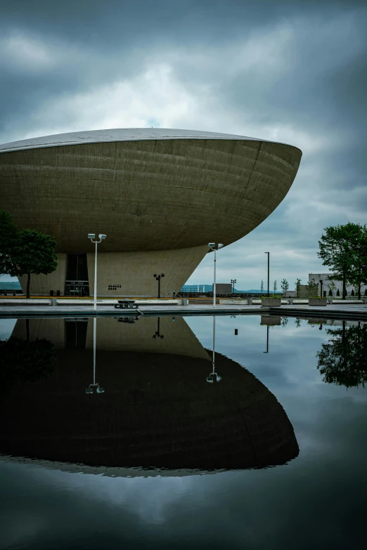 large structure sits on the water under a cloudy sky