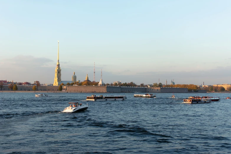 some boats floating on a large body of water