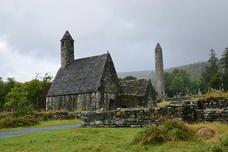 old ruin with stone chimneys in rural setting