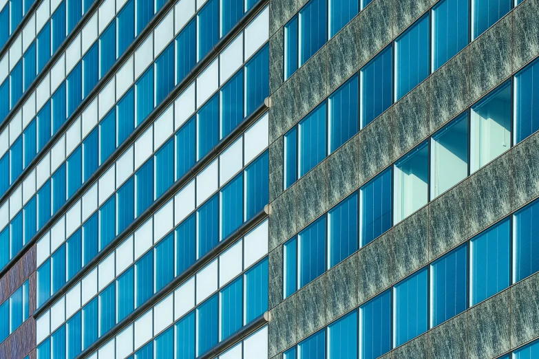 a modern building with many windows in blue colors