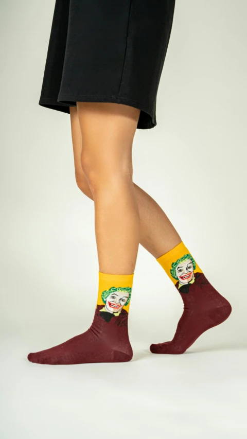 a woman's legs with socks with a joker