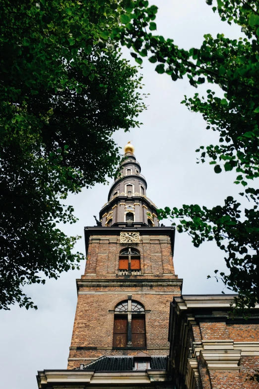 a building with a clock on the front and the top of it