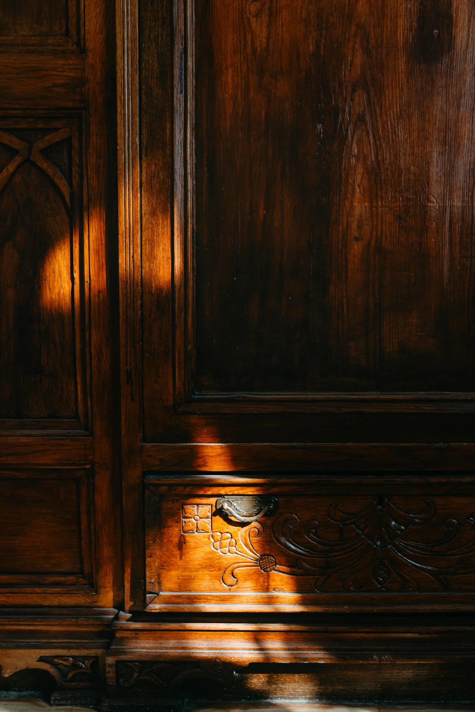 the back half of a wooden cupboard with carvings