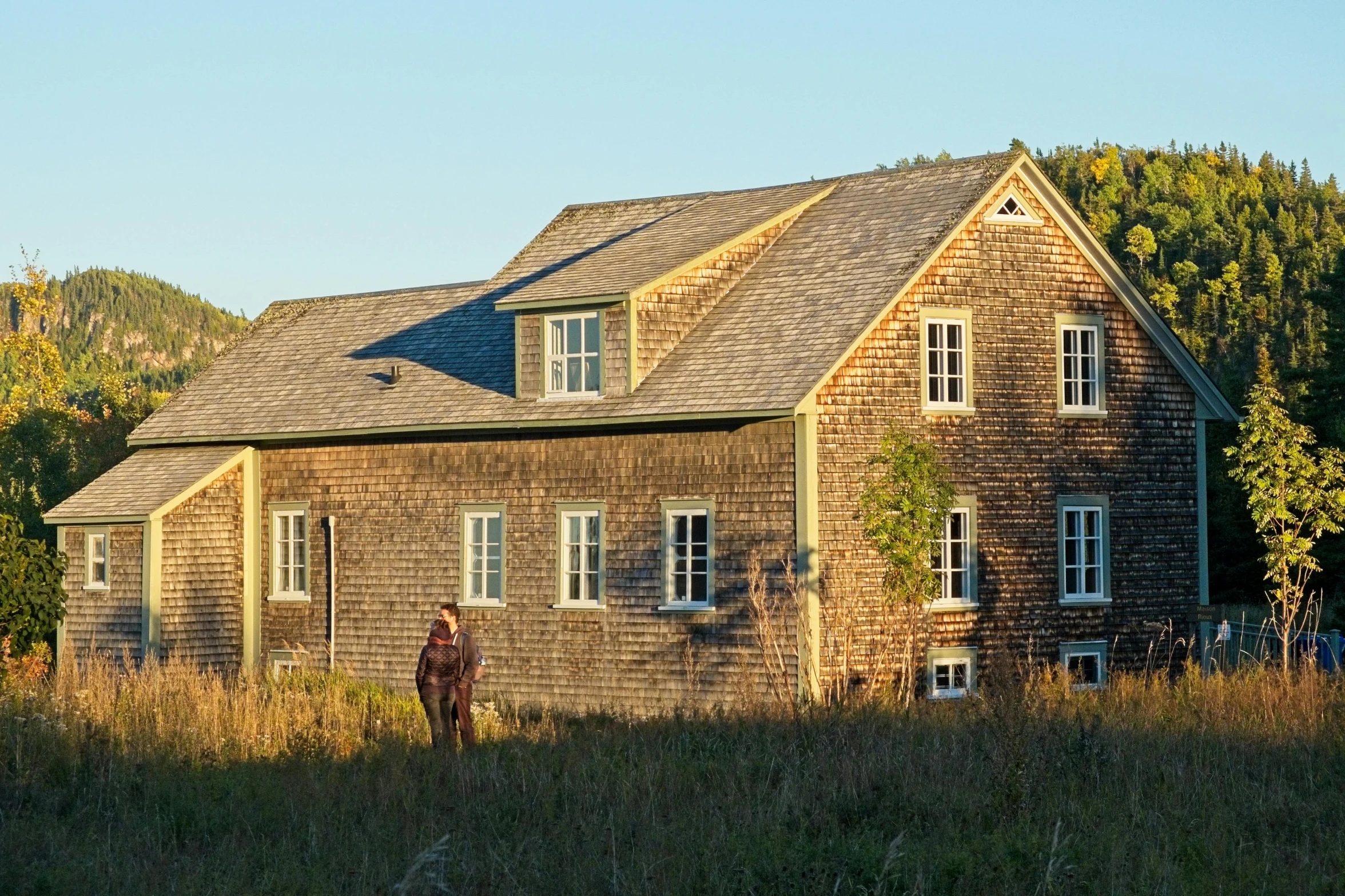 this is a picture of a big house in the woods