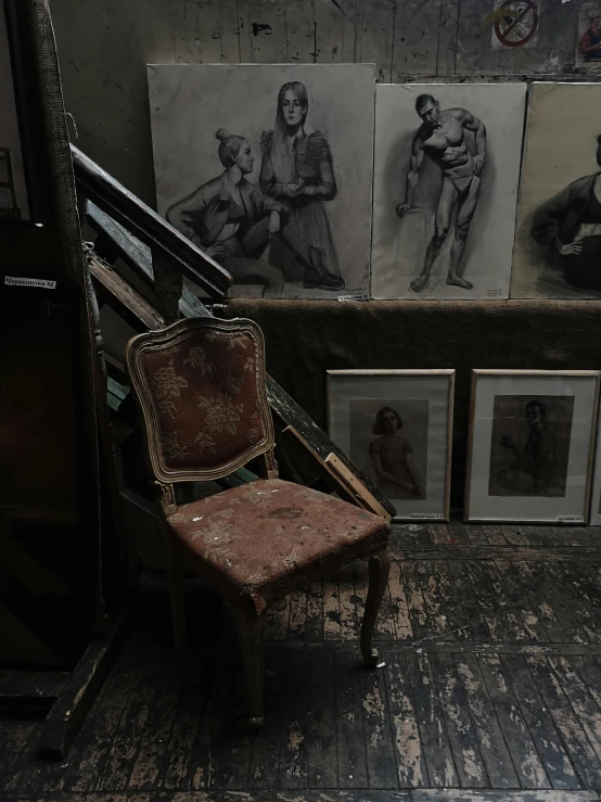 an abandoned chair in the middle of the floor near a staircase