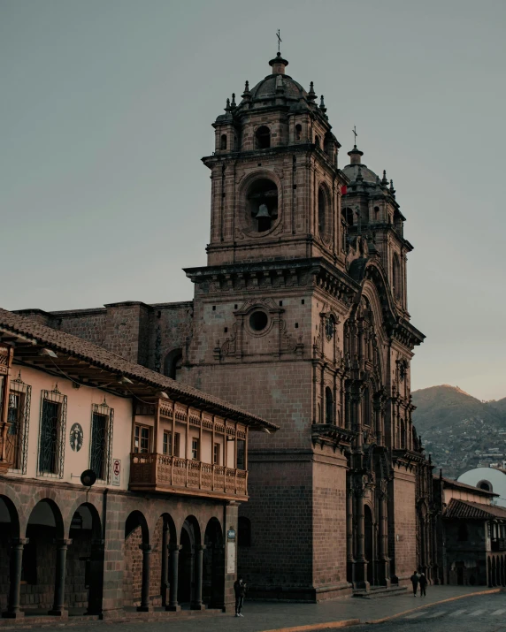 an old church is shown with a sky background