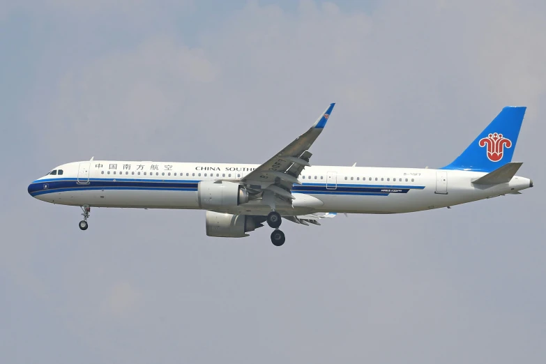 an airplane is flying through the air on a clear day