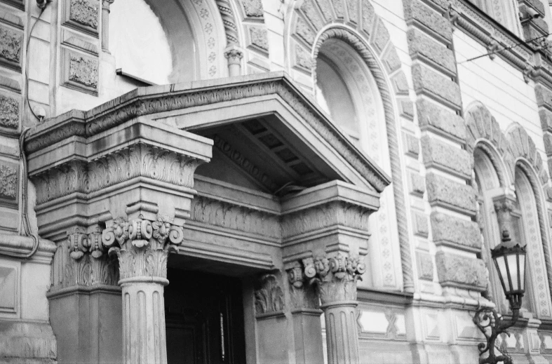 an old building with a clock at the front of it