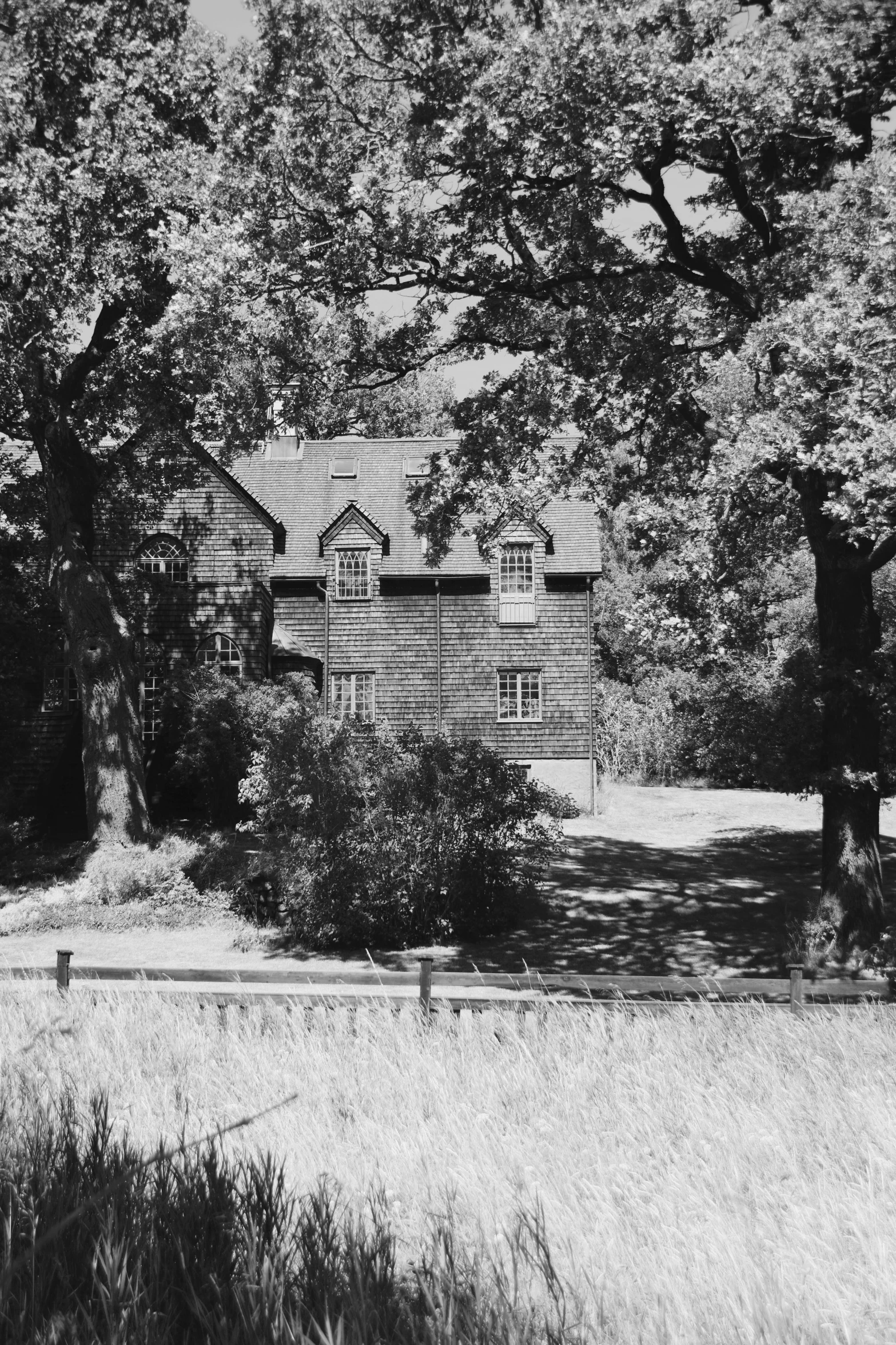 an old wooden house sitting in the woods